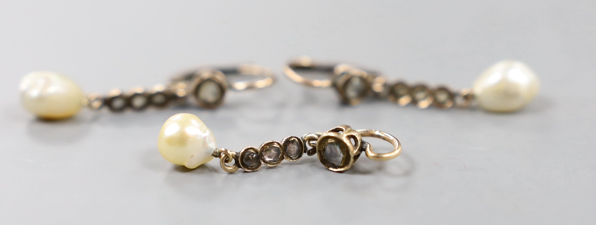 A pair of yellow metal, baroque pearl and rose cut diamond set drop earrings, 38mm and a similar pendant, gross weight 5.9 grams.